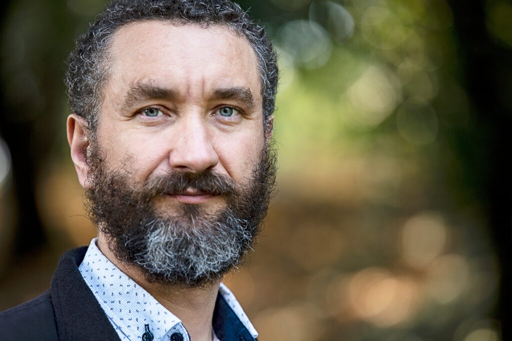 Man with beard and serious confident expression on his face